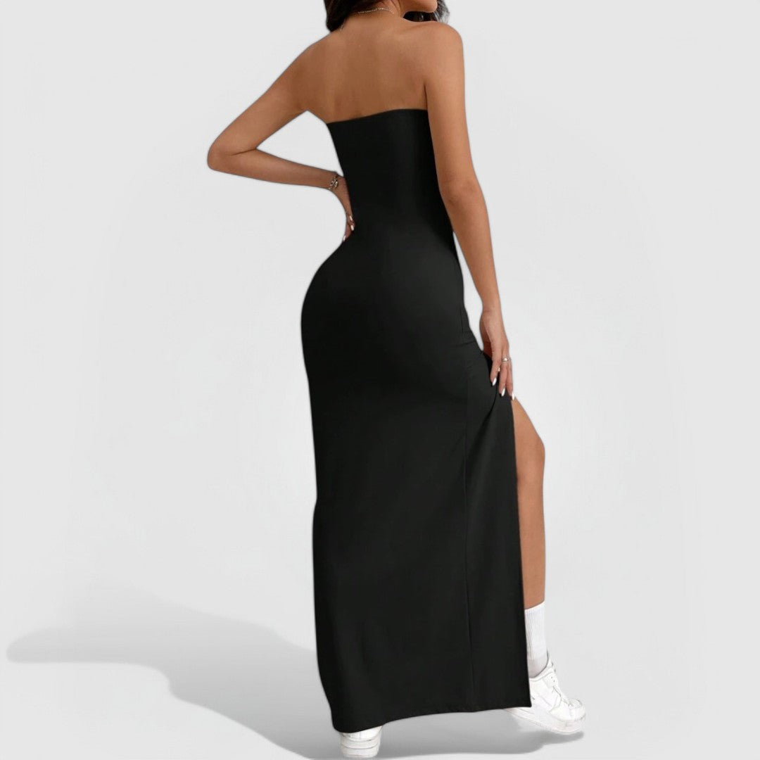 Strapless Slit Maxi – Black shown from back with sleek fit, strapless neckline, and high thigh slit worn with white sneakers