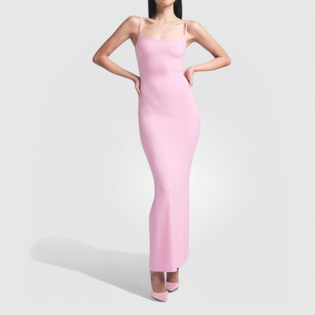 Woman wearing a pink Sculpting Maxi Dress with thin straps and a fitted, ribbed knit silhouette.