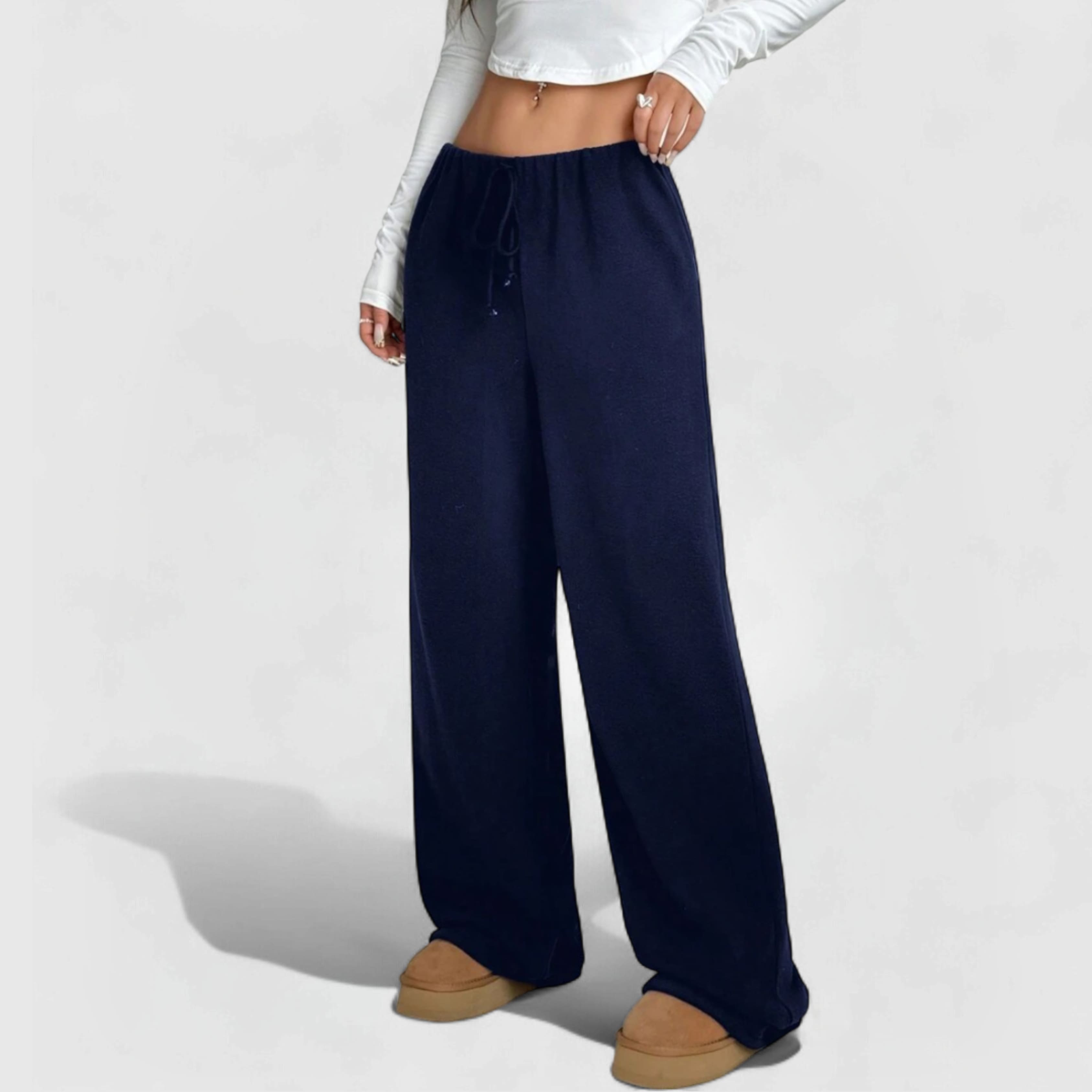 Cozy Fleece Joggers - Blue worn by model, featuring relaxed fit, elastic waistband, and full-length soft fleece pants.