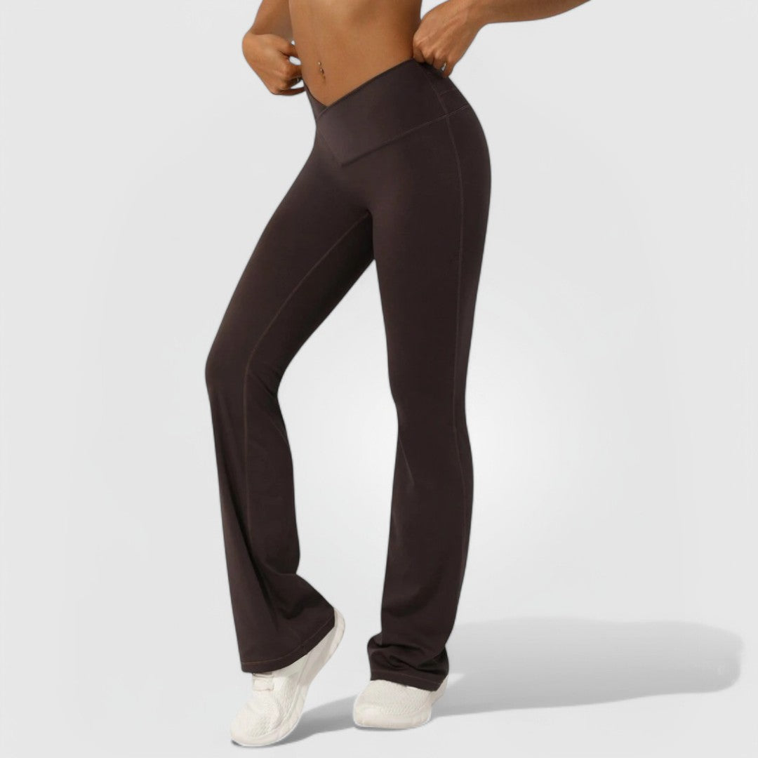 Model wearing Everyday Flare Pants - Mocha, high-waisted with soft stretchy fabric and flared legs.