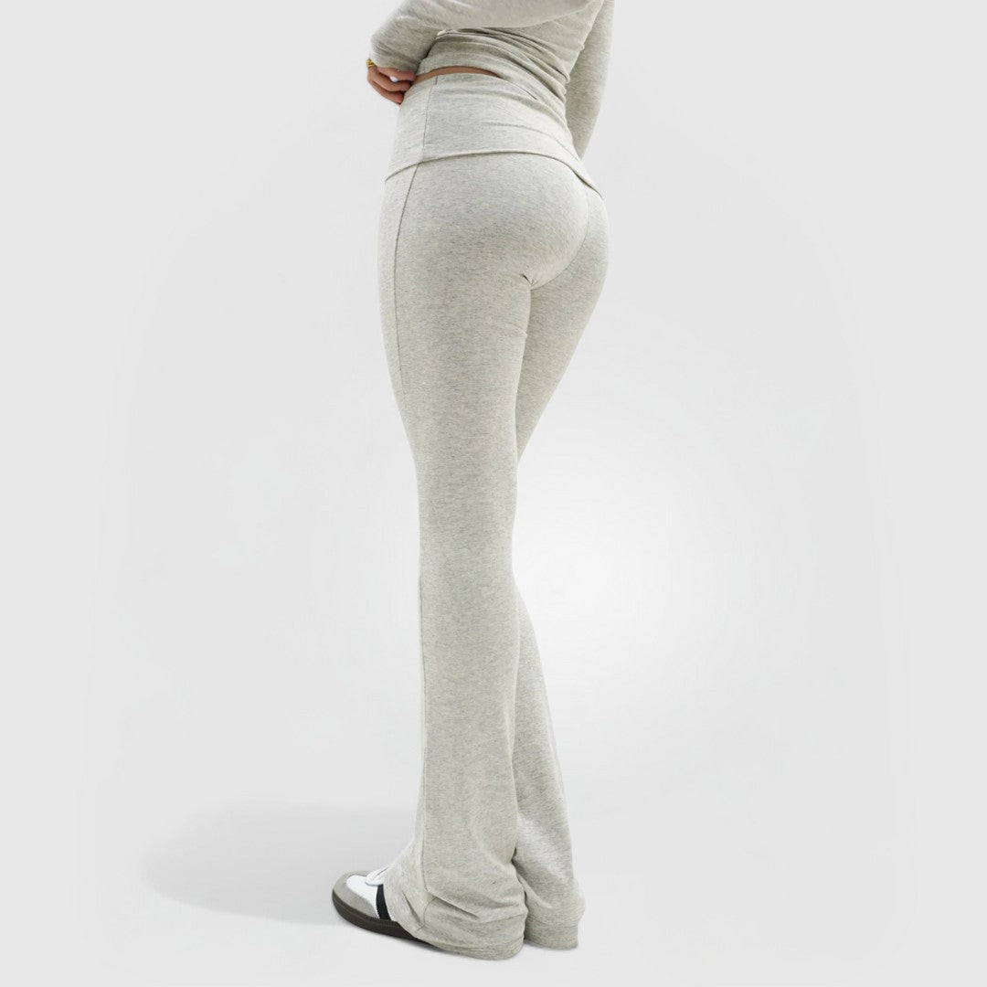 Woman wearing grey CloudKnit™ Flare Leggings with high-rise waistband and ankle-length fit, shown from back.